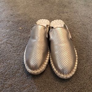 Metallic light gold mules.
